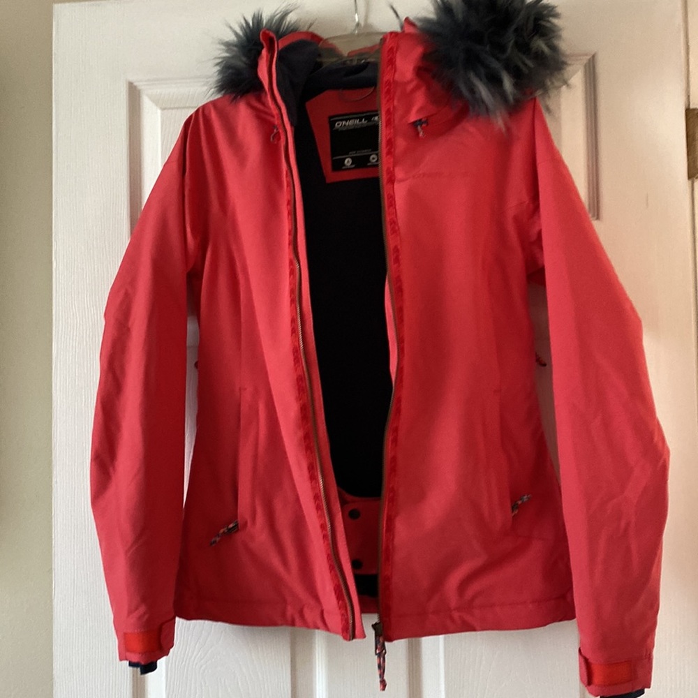 Coral O’Neill blue faux fox fur hooded performance jacket.